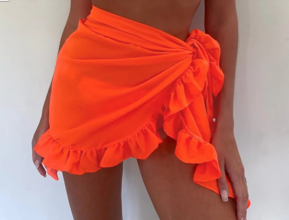 SOFI | WRAP KURZER CHIFFON-SARONG ALS STRANDÜBERWURF